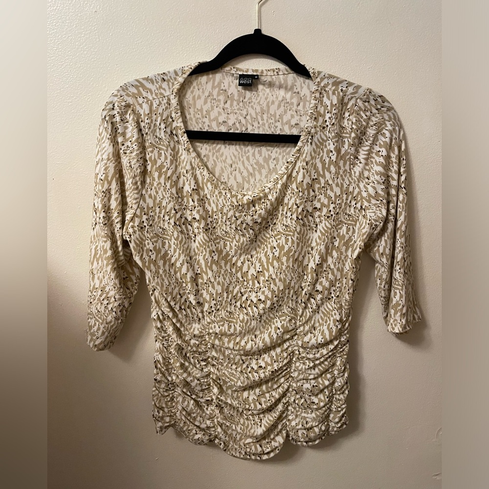 600 West. Brown and white size medium rouched blouse